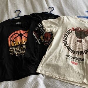 3 Stranger Things Graphic T-Shirts. Different sizes. Some NWT. Some used.